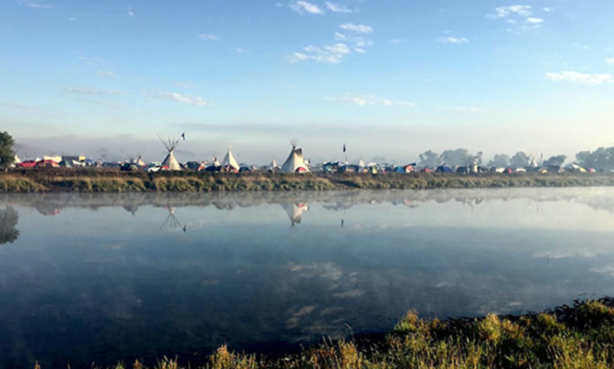 Sunrise on the Cannonball River and the Oceti-Sakowin camp Standing Rock Sioux Reservation, photo by Thane Maxwell